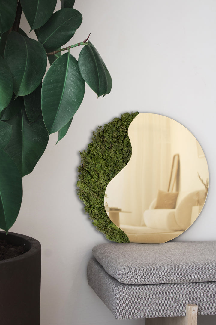 Gold-colored mirror with reindeer moss